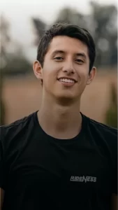 A young man smiling with healthy gums thanks to treatment in Plantation, FL.