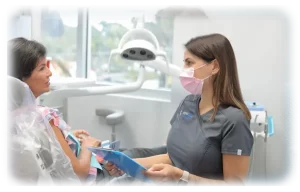 A dental care provider discussing comprehensive dental care.