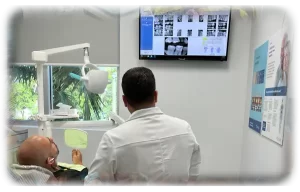 An image of a dentist looking at dental X-rays.